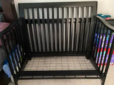 Wooden baby crib in good condition. Mattress not included. Converts to a toddler bed (which is shown...