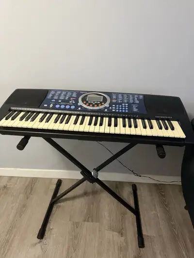 Panasonic piano keyboard 61 keys in good condition comes with stand and adapter FCFS