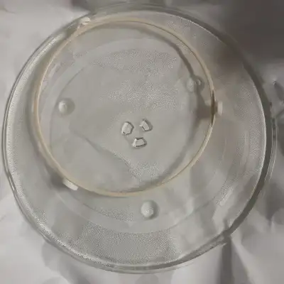 Basically new. Ordered it when our original one broke and he bought a new microwave when he got tire...