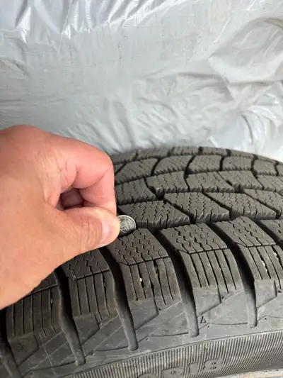 Set of 4 winter tires on rims for 2019 Ford Escape, 235/50R18, less than 10,000 kms. $800.00 firm. P...