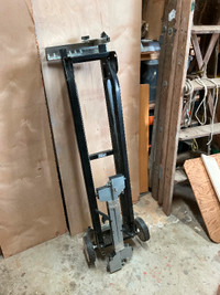 Craftsman portable mitre saw stand with quick-mount support.