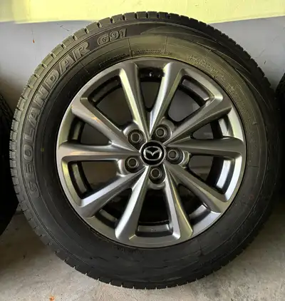 Selling a complete set of 4 - Yokohama Geolandar tires (P225/65R17 100H) mounted on alloy rims with...