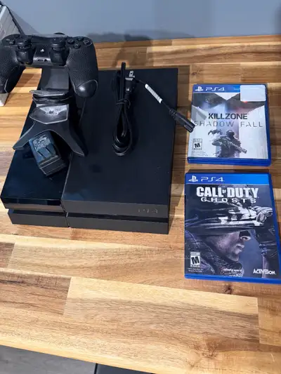 Selling a Sony PlayStation 4 (PS4) gaming console bundle. Great for someone looking to get into Play...