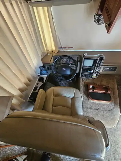 2004 motor home. V10 motor. 2 slides, bed slides out. 2 ac units. Only 77519 miles. Need more info t...