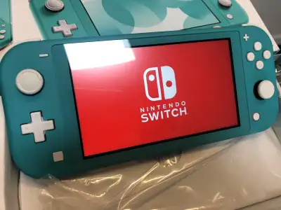 Nintendo switch lite turquoise, like new condition, asking $200, View more
