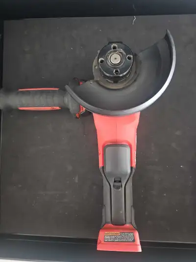 This is a new Milwaukee angle grinder with a 5-inch grinding wheel capacity, perfect for cutting or...