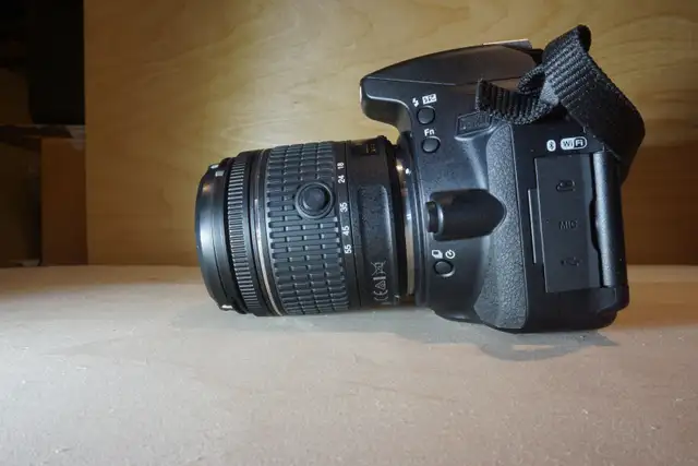 Nikon D560064722634564099124