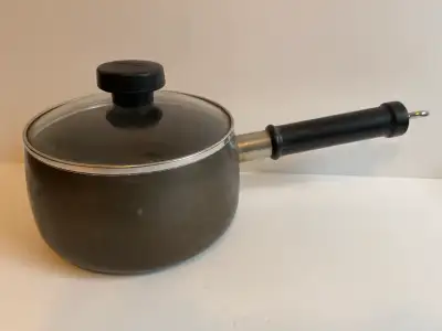 Small used saucepan, dark grey colour. Matching glass lid with a black knob. Black handle. Good cond...