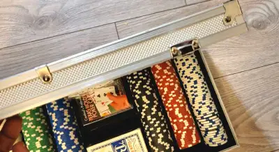 Get ready to shuffle up and deal with this used poker set, perfect for your next game night! This co...