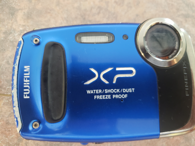 I have a working FUJI FinePix XP50 Waterproof Digital Camera. Has SD slot, 14.4MP. It is in good con...