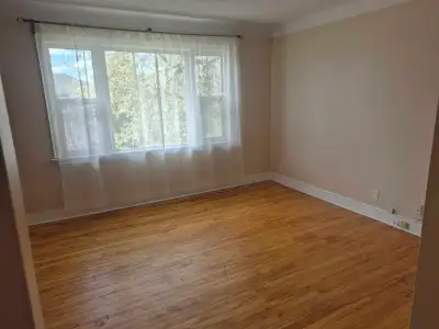 Large, bright 2 bedroom apt in triplex building (top unit) Available June 15, located in a quiet res...