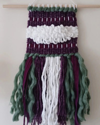 Purple,  green and white wall hanging 