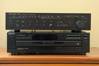 - Harman Kardon HK385i stereo receiver amp. - Sony CDP C345 5-CD player. - Panasonic DVD-S29 CD-DVD...