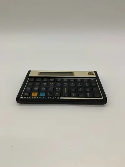 HP 12C Financial Calculator being sold AS-IS for parts or repair. The calculator currently does not...