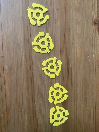 Record player 5 original centers for single record size. Mail shipping is extra cost.