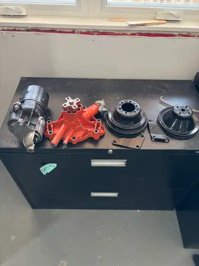 I'm offering a collection of molar parts, including a starter, water pump, and pulleys. These parts...