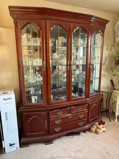 Selling a China cabinet 67” wide 17” deep and 82” high.