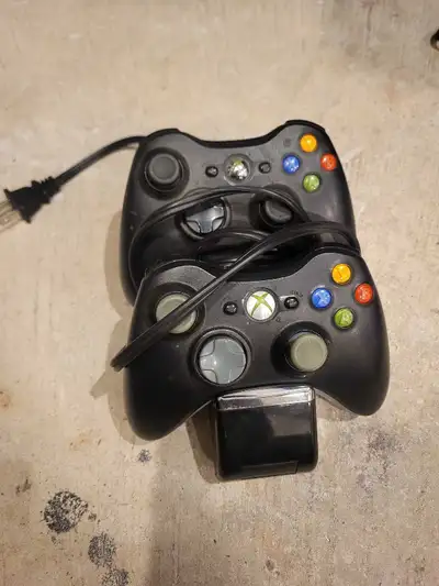 Located in pineridge 2 xbox 360 controllers with rechargeable batteries 1 charger Controllers have 0...