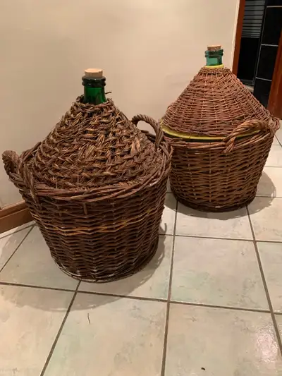 Two reed covered Demi Jon. Clean and ready to use. 54 litre wine storage.