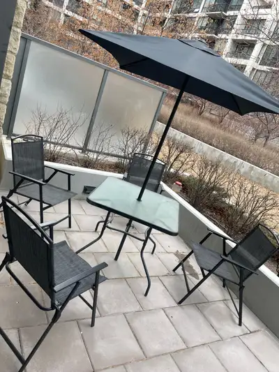 Patio Table, Umbrella & 4 Chairs :) Pickup downtown Eau Claire $75.00 for everything. Thanks