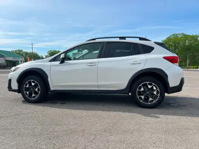 Reliable, certified, fuel-efficient, and ready for all seasons. This white 2020 Subaru Crosstrek is...