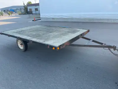 2005, 8’x12’ flat deck Sled/Quad/utility trailer with ramp. 15” tires and new lights all round. Can...