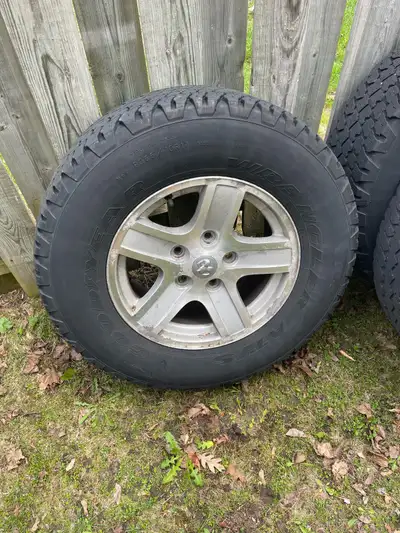 Just took these off my Dodge Durango. Older aluminum wheels and tires. 5x139.7 or 5x5.5 wheels 265/7...