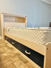 Twin bed with mattress and headboard