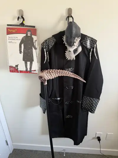 Get ready to spook with this Spirit Skeleton Undertaker Costume adults, size medium, complete with a...