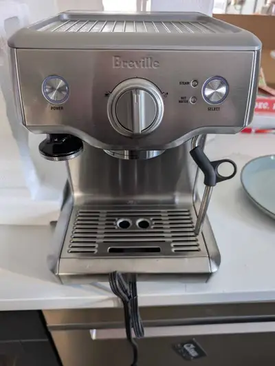 Like new, comes in the box with all parts and filters along with a stainless steel milk frothing cup...