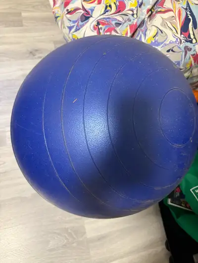 Get ready to bounce into action with this blue exercise ball, perfect for your home workouts! It's g...