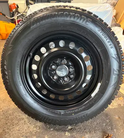 Like new, tons of tread. Was on Subaru Outback 225/65/R17 comes with nuts/ locking nut Will deliver...