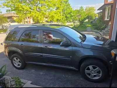 This 2009 Chevrolet Equinox is a reliable crossover with 204,729 kilometres, featuring a grey exteri...