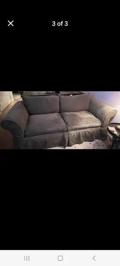This cozy living room sofa is looking for a new home! It's seen some use and is in good condition, r...