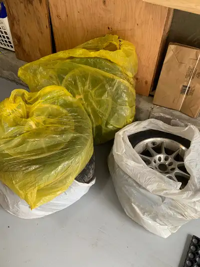 Winter tires on alloy rims, universal 4 bolt rims only used 1 season. 3 matching tires, one differen...