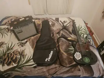 Electric guitar with amp and other needed items, View more