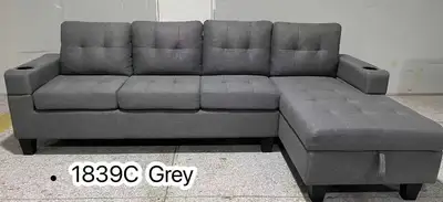 This stylish grey sectional sofa offers both comfort and versatility to any living space. The sectio...