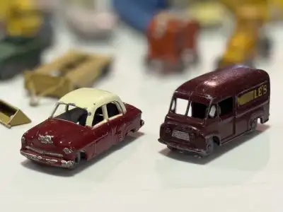 Very old vintage metal vehicles used for model train set most are made in England by Lesney Price is...