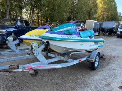 Selling two jetskis with a double trailer. Purple and yellow is a 1995 Seadoo HX 720 -New carb kit -...