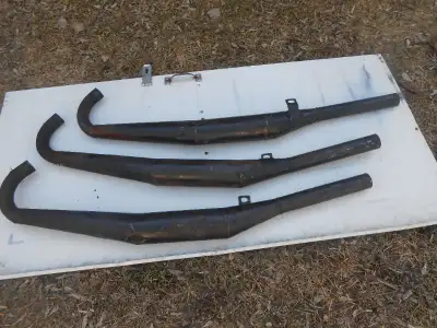 Vintage 72 - 75 Kawasaki H2 750 triple aftermarket chamber exhaust pipes, Brand Unknown. These are a...
