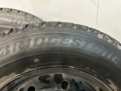 Bridgestone winter tires on steel rims 215/65/16 85-90% tread (5x100) subaru, toyota chrysler Please...