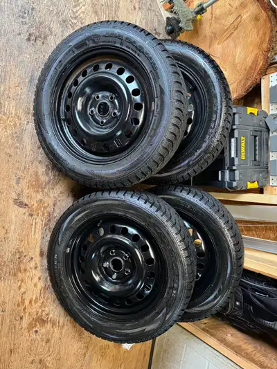 I'm selling a set of 17-inch winter tires mounted on rims, perfect for safe driving in snowy conditi...