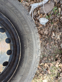 Michelin All Season Defenders tires on rims from Subaru