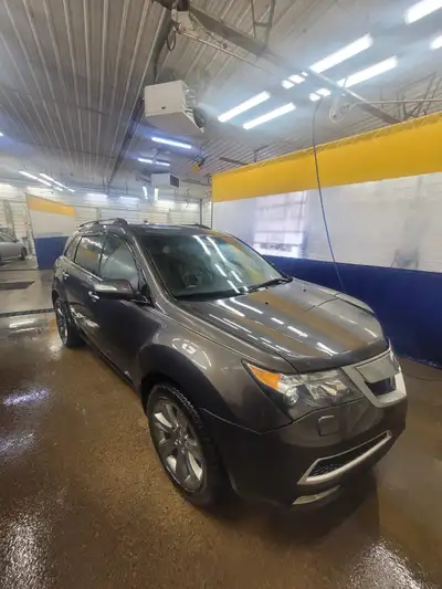 2010 Acura MDX Elite. Around 373,000 Kms, mostly highway because of work nature. In daily use. Still...