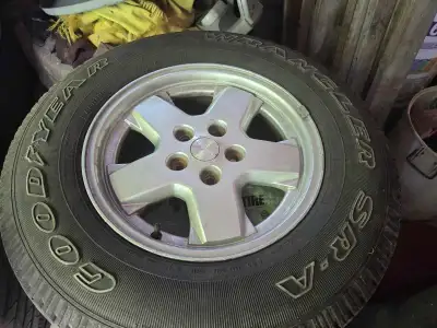 Set of 4 Goodyear Wrangler tires on rims from a 2005 Jeep Liberty 235 70 R16 in excellent condition....