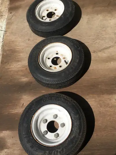 THREE 5 BOLT TRAILER WHEELS...TWO 4.80-8 WHEEL WITH NEW CARLISLE TIRE...ONE 5.30-12 TIRE ON RIM...$5...