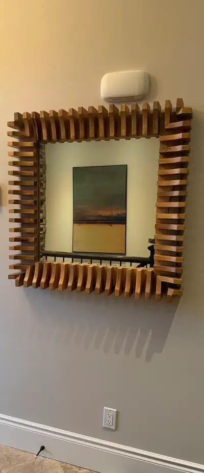 Wooden frame wall mirror. W and H: 35,5”