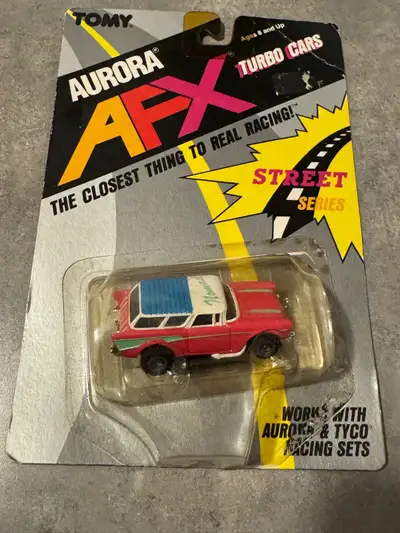 Brand New TOMY TURBO AFX 57' CHEVY NOMAD-PINK/WHITE BLISTER PACK GLUE HOLDING PLASTIC CASE DRIED OUT...