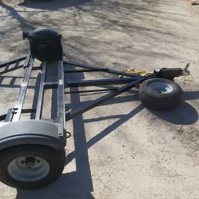 Ezee tow car dolly, good condition, surge brakes, spare tire, tie down straps. Call 204 274 2630 or...