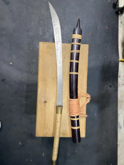 a Burmese Dha sword with a wooden scabbard. 34”, View more